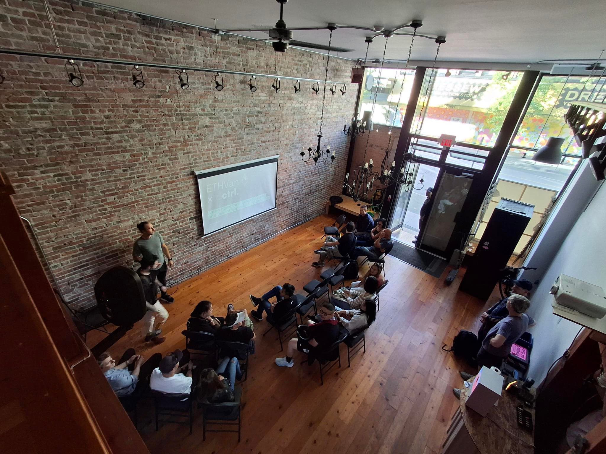 A talk in progress at DCTRL with the audience seated on the main floor